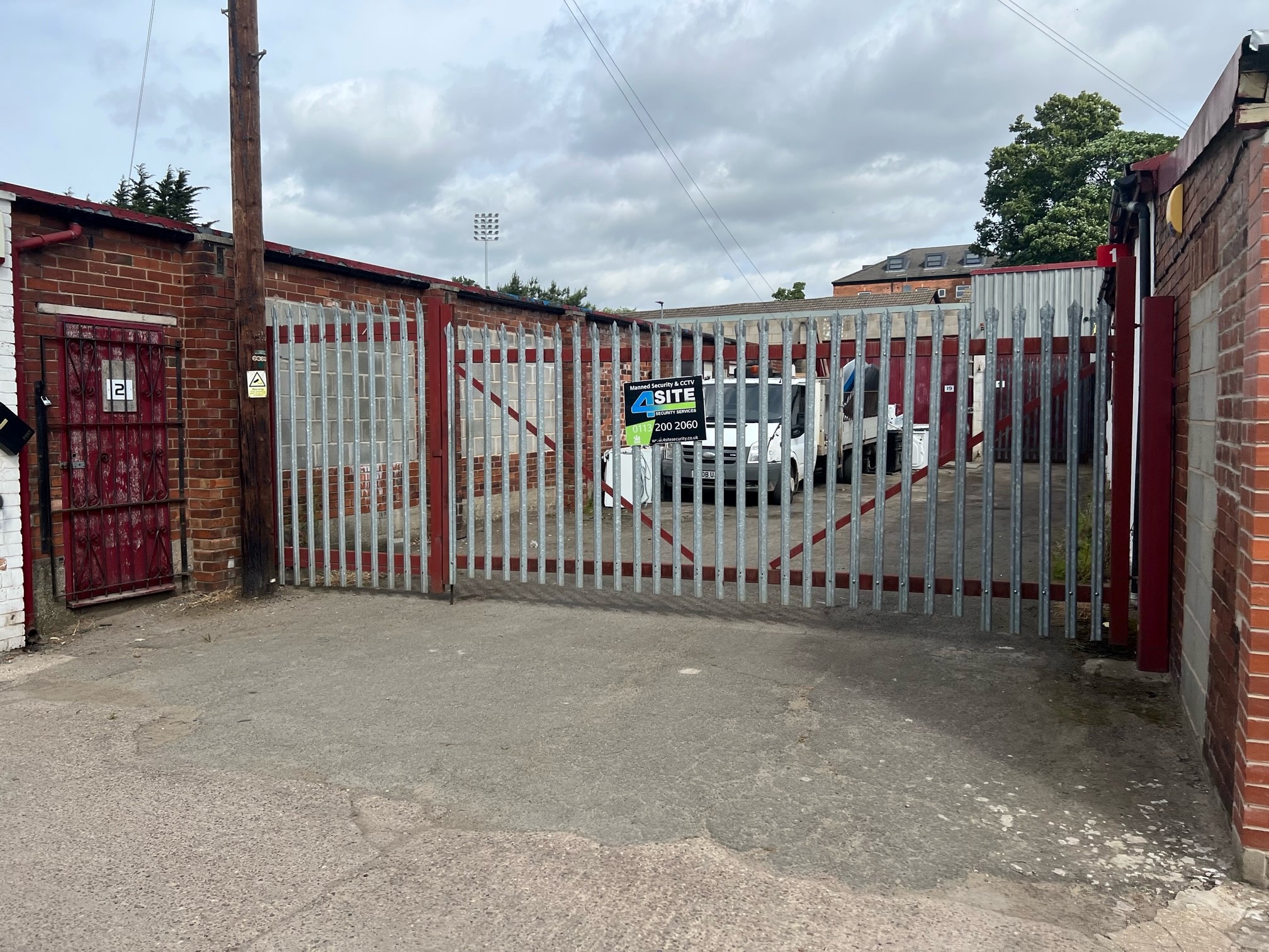 Entrance gates and the secured yard at Massarella’s Yard